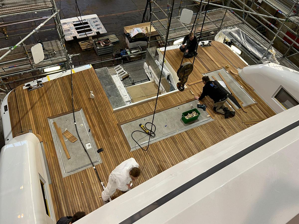 New teak decking being laid on a yacht